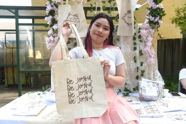 Pictured is: Fiona Truong (19) and her company Joyfi Designs.

Picture: Sarah Standing (210622-9965)