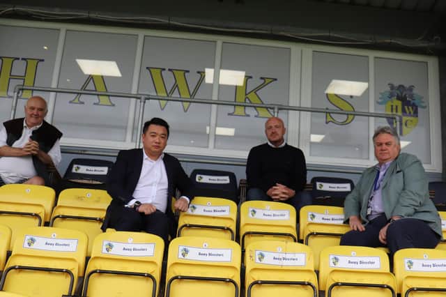 Alan Mak, second left, meets Hawks officials at Westleigh Park last Friday. Pic: HWFC.