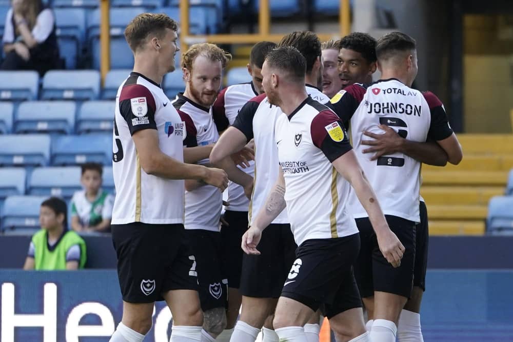 The Pompey players celebrate Reeco Hackett-Fairchild's opener against Millwall. Picture: Jason Brown