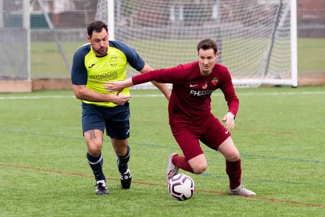 FC Strawberry (red) take on Harvest Home in last season's Len Day Cup. Picture: Duncan Shepherd