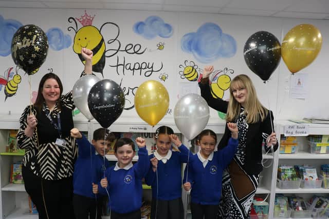 Executive Headteacher Sara Paine (left) and Rachel Thripp (right) celebrate with pupils.