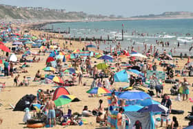 A packed beach at Bournemouth last Friday, but nobody is allowed to socially distance at a non-league football match at the moment. Pic: Getty Images)