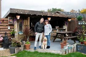 John & Anita Simmons with dog Bertie at their pub shed called The Dog & Ball in Horndean. Picture: Tony Kershaw/SWNS