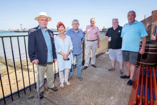George Edward Carpenter with his family, Christine Croft and Peter Carpenter, Cllr Jamie Hutchinson, Mike McGeever and Andy Burdon at The Powder Monkey, Gosport 
Picture: Habibur Rahman