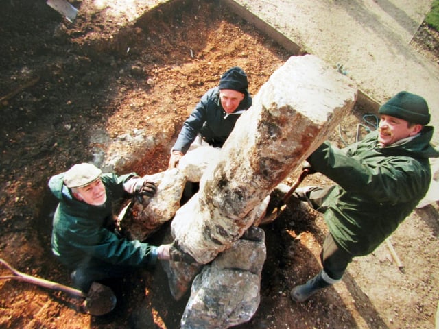 Royal Marines Museum Maintenance staff (clockwise) Chris Roser, Bill Samways and Jim Tann, place the large stones from the Falkland Islands, to form part of the outdoor memorial to the Royal Marines. 26th january 1996. Picture: Pete Langdown