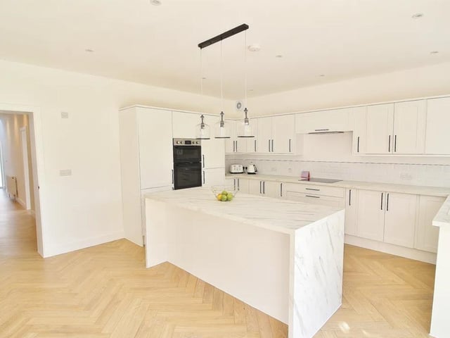 This property comes with four bedrooms, four bathrooms and two reception rooms as well as a spacious garden and private parking.