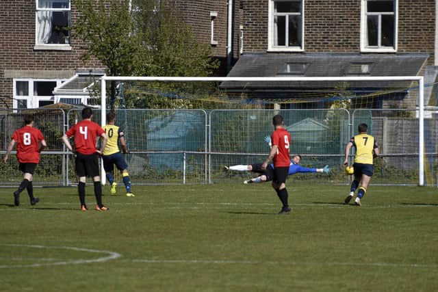 Dan Kempson guesses the right way this time, but Steve Hutchings scores his second penalty for Moneyfields. Picture: Allan Hutchings