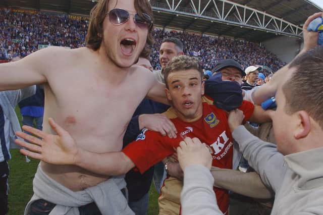 Andres D'Alessandro was mobbed by Pompey supporters after their Premier league survival was assured at Wigan in April 2006. Picture: Steve Reid