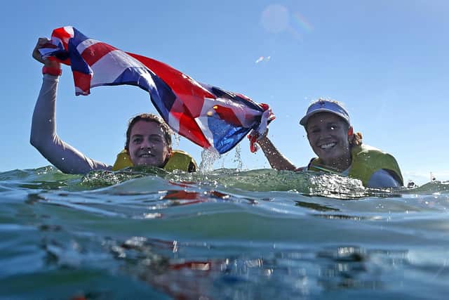 Hayling Island's Eilidh McIntyre, left, and sailing partner Hannah Mills celebrated their Women's 470 Class Tokyo gold medal win by diving into the Enoshima water. Picture: Clive Mason/Getty Images