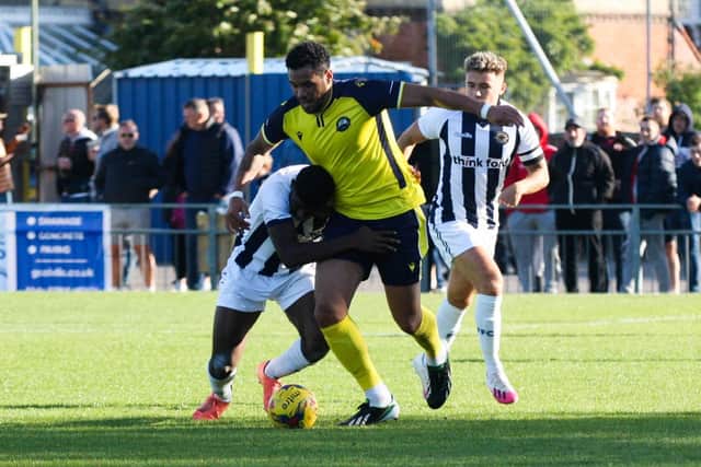 Jordan Rose is held back during Gosport's 4-0 home win over Farnborough. Picture: Tom Phillips.