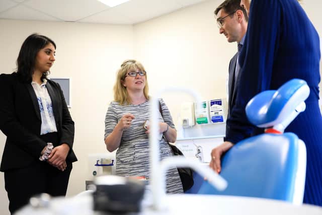 The minister chats with dentist Janita Dhariwal, left, and chairman of the Hampshire and Isle of Wight Local Dental Committee, Phil Gowers.
Picture: Chris Moorhouse (jpns 270622-06)
