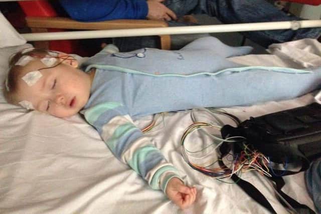 Shay Glenton, 8 from Lee-on-the-Solent, will be cycling for two hours straight to raise money for University Hospital Southampton which has cared for him since his diagnosis of epilepsy and subsequent brain surgery. Pictured: Shay being scanned as a young child