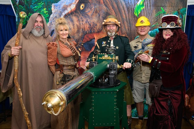 Pictured is: Members of the Gosport Steam Punk Society are joined by a Mystic traveller and member of staff from the Jurassic Park.

Picture: Keith Woodland (140421-4)