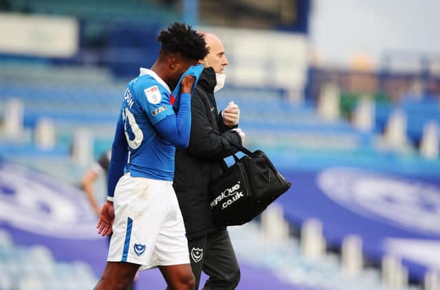 Ellis Harrison was forced off injured to add to Pompey's disappointing day against Doncaster. Picture: Joe Pepler