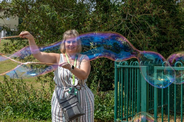 Debbie Mead from Hampshire Healthy Families demonstrates her giant bubble making skills at the Party in the Warren. Picture: Mike Cooter (080723)
