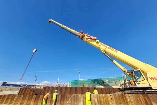 Sea walls shaping up in Southsea
New sea defences are taking shape at the Southsea Coastal Scheme as a massive 220 tonne crane installs the first limestone and granite units that will form a wall to protect the area around Long Curtain Moat from future flooding.