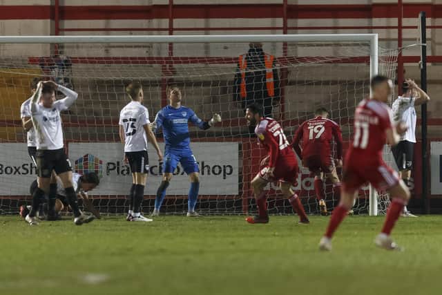 Pompey players dejected after conceding a late equaliser against Accrington. Picture: Daniel Chesterton/phcimages.com