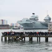 The Royal Navy aircraft carrier HMS Queen Elizabeth passes the Round Tower as it leaves Portsmouth on May 1. Picture: Andrew Matthews/PA Wire
