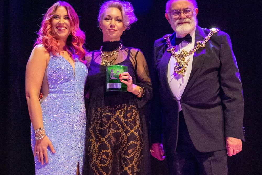 Sophie Cartledge (centre), of Hormones on the Blink, picking up her award for emerging business at The Pamodzi Inspirational Women of Portsmouth Awards 2023. Sophie is pictured with Hannah Roper of The Female Creative and the Lord Mayor of Portsmouth Hugh Mason Picture: Emma Terracciano