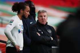 Kenny Jackett tries to offer words of encouragement to a dejected Marcus Harness after Pompey's Papa John's Trophy final defeat to Salford. Picture: Joe Pepler