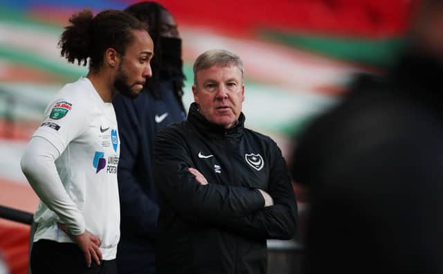 Kenny Jackett tries to offer words of encouragement to a dejected Marcus Harness after Pompey's Papa John's Trophy final defeat to Salford. Picture: Joe Pepler