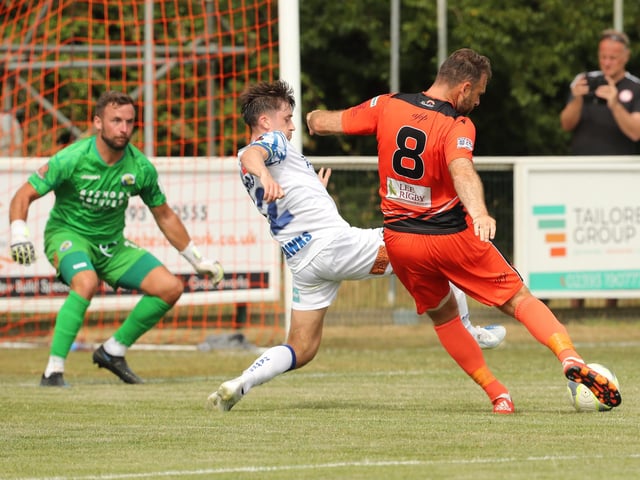 Brett Pitman about to level for Portchester despite a challenge from Benny Read - Charlie Searle is the Hawks keeper. Picture by Dave Haines