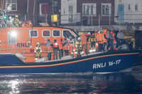 Over 100 illegal migrants aboard two RNLI lifeboats entered Portsmouth Harbour on Sunday evening just after 10pm, heading for Fort Blockhouse in Gosport, Hampshire where teams from the Home Office were there to welcome the migrants. They were then heading to board one of a number of buses waiting for them. Pictured passing Fort Blockhouse.   Please credit: pictureexclusive.com