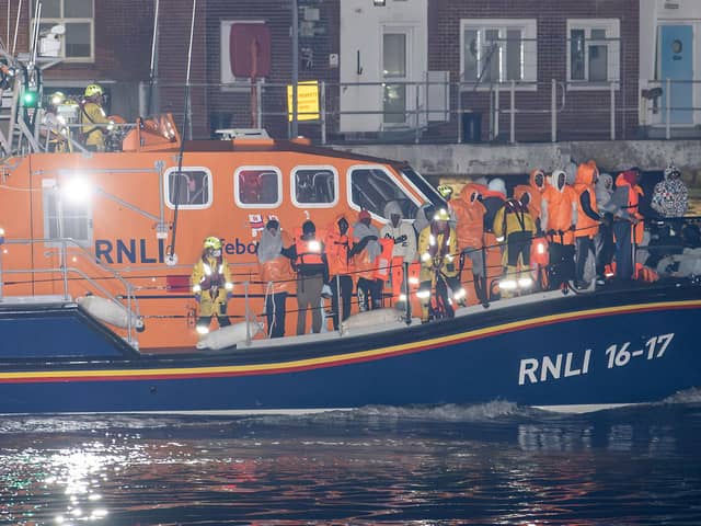 Over 100 illegal migrants aboard two RNLI lifeboats entered Portsmouth Harbour on Sunday evening just after 10pm, heading for Fort Blockhouse in Gosport, Hampshire where teams from the Home Office were there to welcome the migrants. They were then heading to board one of a number of buses waiting for them. Pictured passing Fort Blockhouse.   Please credit: pictureexclusive.com
