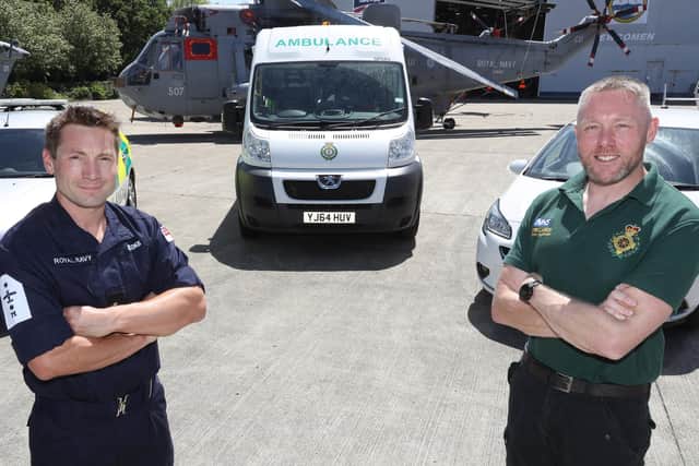 Pictured left to right LAET Gordon Brooks and Lt Cdr Chris Wood, who both worked to support paramedics during the coronavirus crisis.