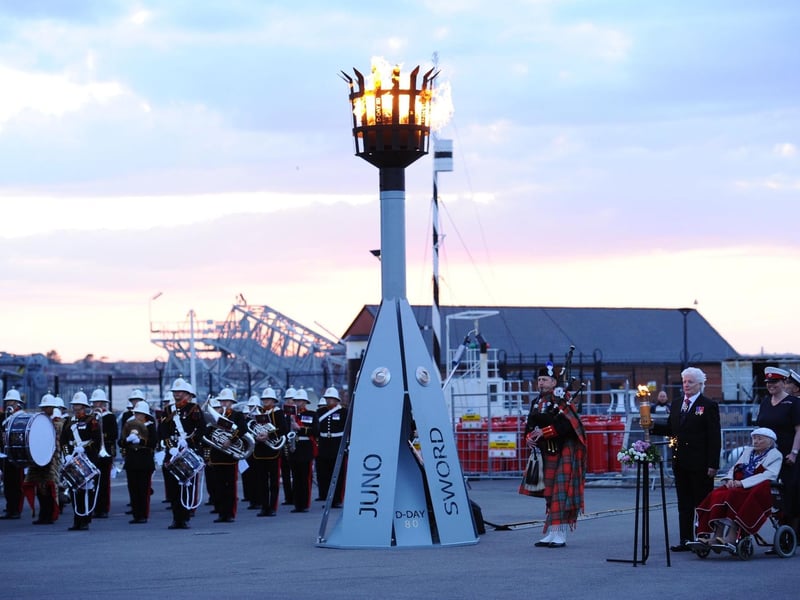 The beacon, which features the names of the beaches were troops landed, after it has been lit at Portsmouth Historic Dockyard