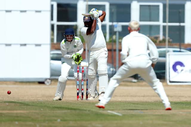 Portsmouth's Minhaj Jalill celebrated his maiden SPL century against Rowledge.
Picture: Chris Moorhouse