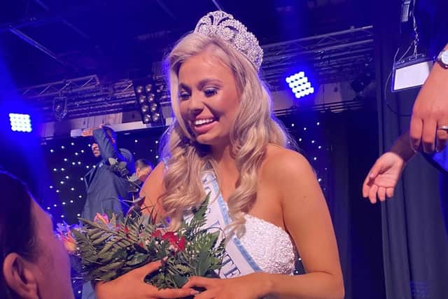Cerys is congratulated with a bouquet of flowers.