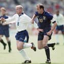England player Paul Gascoigne holds off the challenge of Gary McAllister during the 1996 European Championships Group match against Scotland at Wembley Stadium on June 15, 1996. Photo by Ben Radford/Allsport/Getty Images/Hulton Archive