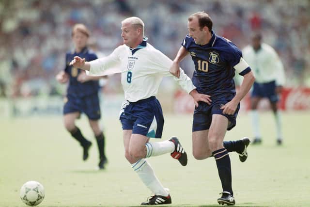 England player Paul Gascoigne holds off the challenge of Gary McAllister during the 1996 European Championships Group match against Scotland at Wembley Stadium on June 15, 1996. Photo by Ben Radford/Allsport/Getty Images/Hulton Archive