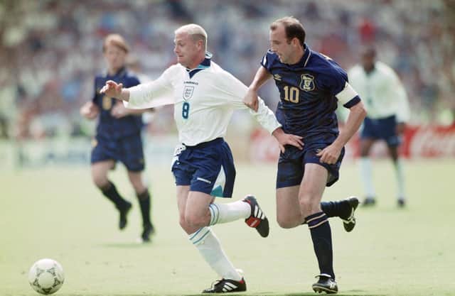 England player Paul Gascoigne holds off the challenge of Gary McAllister during the 1996 European Championships Group match against Scotland at Wembley Stadium on June 15, 1996. Photo by Ben Radford/Allsport/Getty Images/Hulton Archive