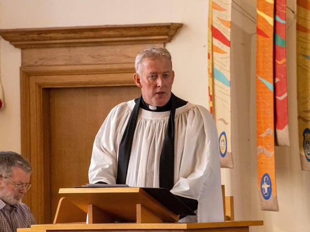Pictured - The service being conducted at the Church of St Barbara
Photos by Alex Shute