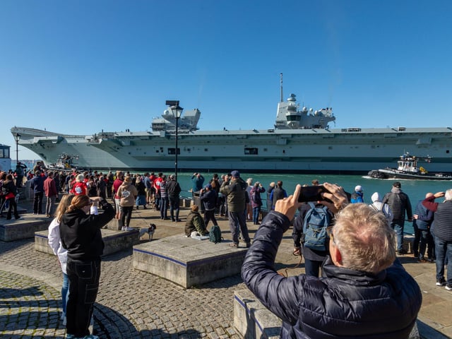 Onlookers at the Point watching HMS Prince Of Wales being deployed. Picture: Mike Cooter (280924)