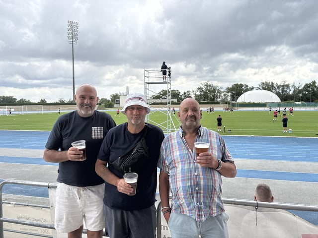 Tony Pullen, aged 55 from Emsworth, Ernie Greenham, aged 63 from Portchester, and Seagull Sam, aged 65 from Fareham, at Pompey's open training session at the X-Bionic Sphere Sports Centre in Šamorín, Slovakia.