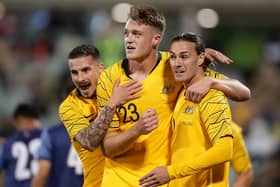 Harry Souttar, centre, playing for Australia