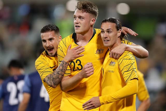 Harry Souttar, centre, playing for Australia