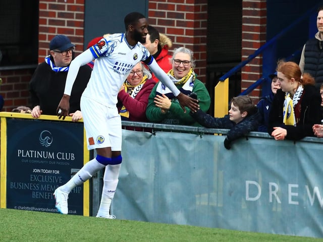 Mo Faal celebrates with the fans at the end of the game. Picture by Dave Haines