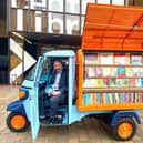 Councillor Steve Pitt, leader of the council, posing in the Tuk-tuk outside central library