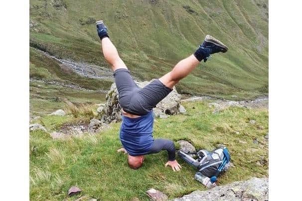 Gethin Jones, from Southsea, during his training for the Three Peaks headstand challenge