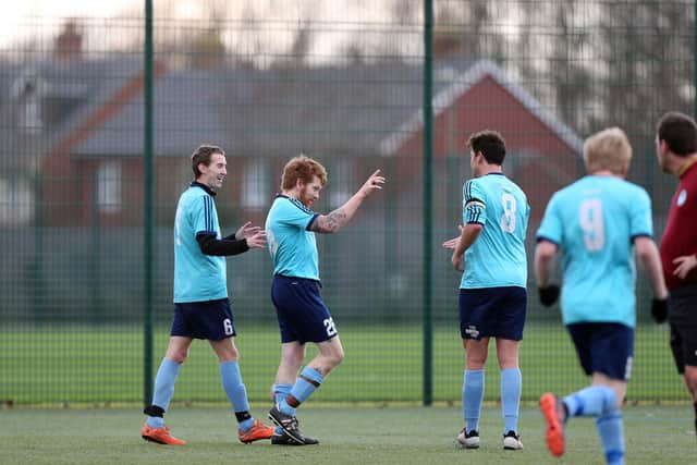 Paul Harris, second left, celebrates his goal against Burrfields. Picture: Chris Moorhouse