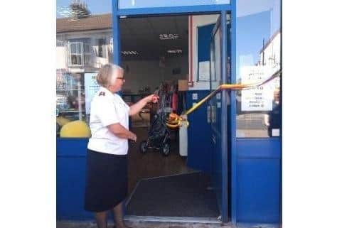 Ribbon cutting at the new children's charity shop.