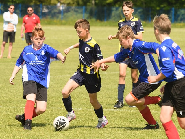 Action from the Clanfield youth football tournament at Horndean Technology College. Picture: Keith Woodland (270521-575)