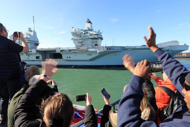The Royal Navy aircraft carrier HMS Queen Elizabeth arrives back in Portsmouth Naval Base after taking part in major exercises off Scotland. PA Photo: Gareth Fuller/PA Wire