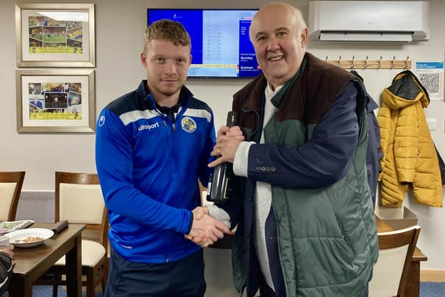 Hawks director Trevor Brock presents hat-trick hero Tommy Wright with his man-of-the-match award. Pic: Kieron Louloudis