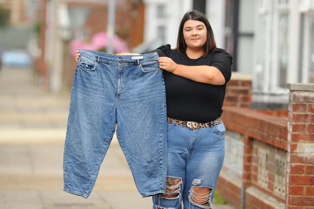 Flo Simpson with her pair of jeans which now fit. Picture: Sarah Standing (180620-4290)