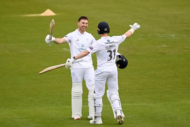 Joe Weatherley of Hampshire celebrates reaching his century with Nick Gubbins. Photo by Alex Davidson/Getty Images.
